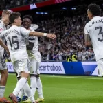 ميليتاو مع لاعبي ريال مدريد المصدر: رويترز