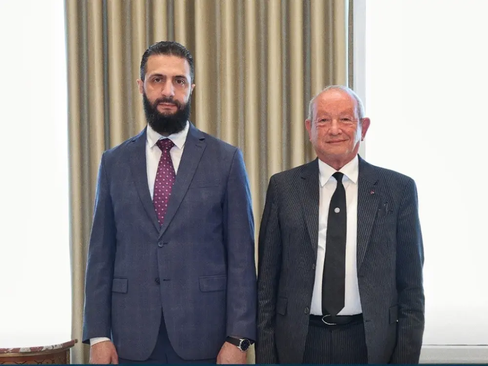من استقبال الرئيس أحمد الشرع رجل الأعمال المصري نجيب ساويرس في قصر الشعب بدمشق -مصدر